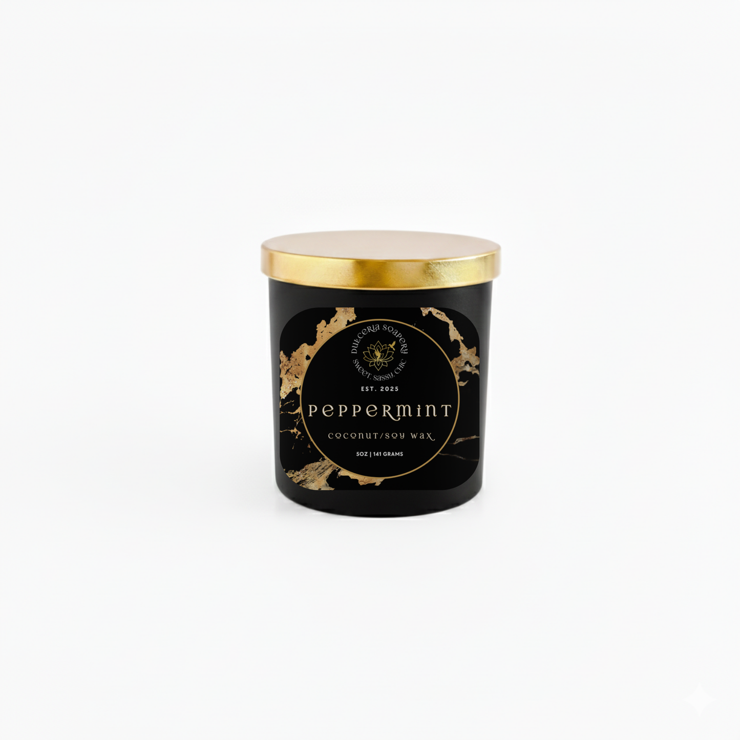Black candle with gold lid and decorative label on a white background