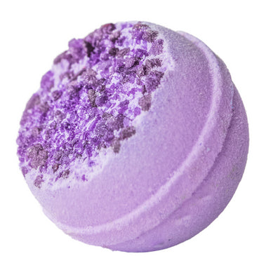 Purple bath bomb with textured surface on a white background