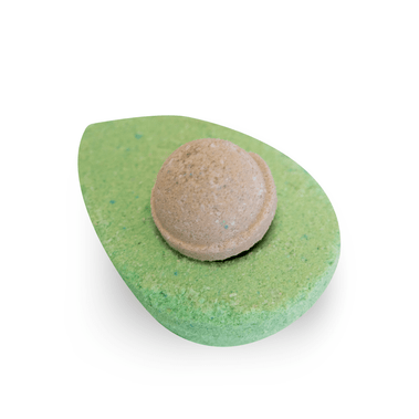 Green bath bomb with a textured center on a white background