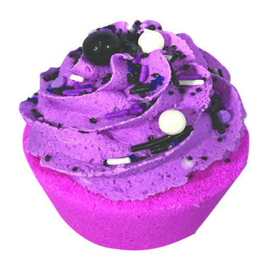 Purple and pink cupcake-shaped bath bomb with black and white sprinkles on a white background