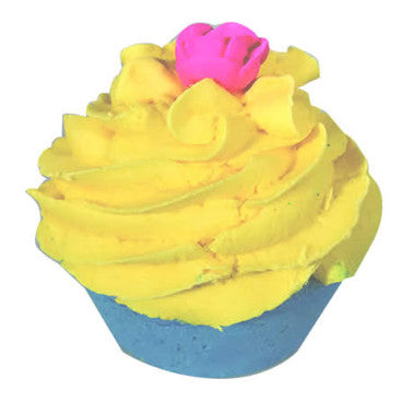 Toy cupcake with yellow frosting and a pink flower on a white background