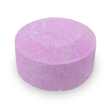 Purple bath bomb on a white background