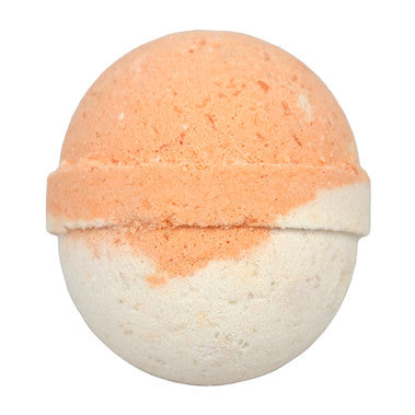 Bath bomb with peach-colored top and white bottom on a white background