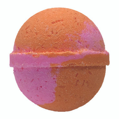 Bath bomb with orange and pink layers on a white background