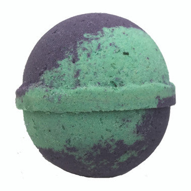 Green and purple bath bomb on a white background