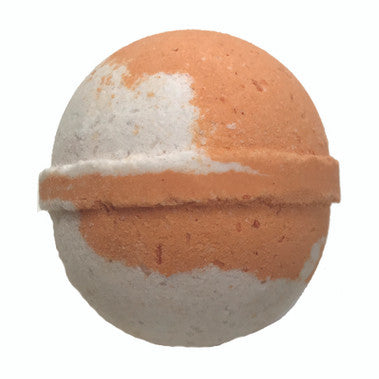 Bath bomb with orange and white layers on a white background