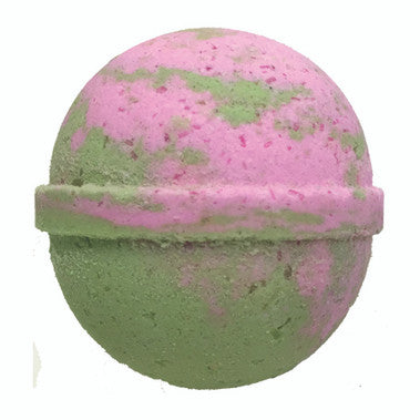 Pink and green bath bomb on a white background