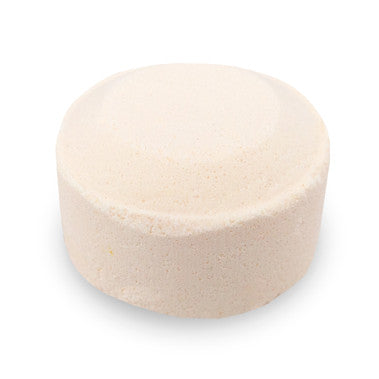 Round beige cushion on a white background