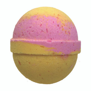 Yellow and pink bath bomb with speckles on a white background