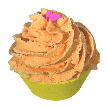 Toy resembling a cupcake with orange frosting and a pink heart on a white background