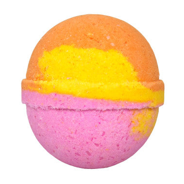 Multicolored bath bomb with orange, yellow, and pink layers on a white background