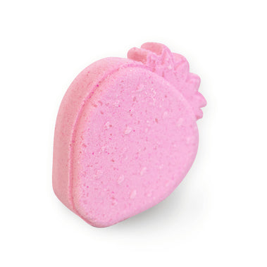 Pink bath bomb with a textured surface on a white background