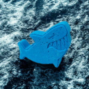 Blue shark-shaped object on a textured blue background