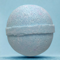 White bath bomb on a light blue background