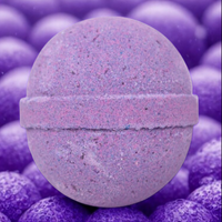 Purple bath bomb with speckled texture on a matching purple background