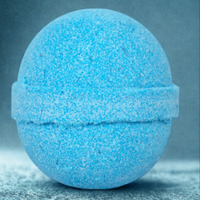 Blue bath bomb on a gray surface