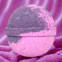 Pink and gray bath bomb on a pink background