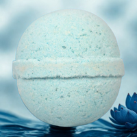Bath bomb with water droplets on a blue background