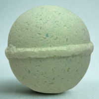 Green bath bomb on a white background