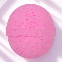Pink bath bomb on a white background