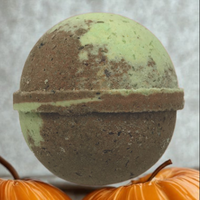 Round green and brown object on a white background