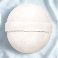 White bath bomb on a light blue background