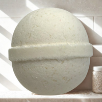 Round beige bath bomb on a white background