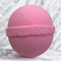 Pink bath bomb on a white background