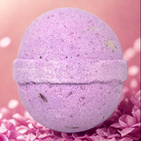 Purple bath bomb on a pink background
