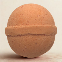 Terracotta-colored ball on a beige background
