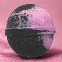 Black and pink bath bomb on a pink background