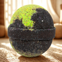 Black and green textured ball on a light-colored surface