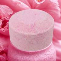 Round pink object with floral background