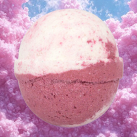 Bath bomb with pink and white color on a pink cherry blossom background